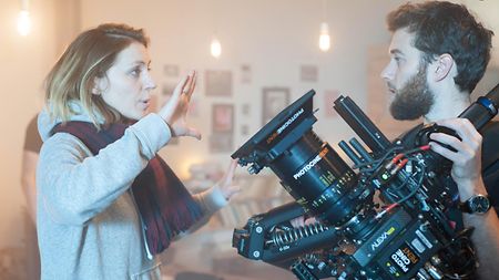 Director Julie Rohart (left) discussing a camera setup