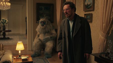 Protagonist Vincent (Benedict Cumberbatch) becomes convinced that monster puppet Eric holds the key to finding his missing son in 1980s New York City (Credit: Netflix)