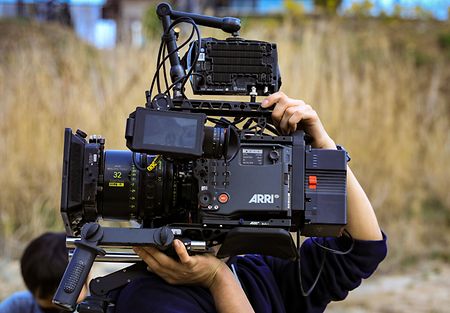 Person carrying an ALEXA35 motion picture camera on his shoulder